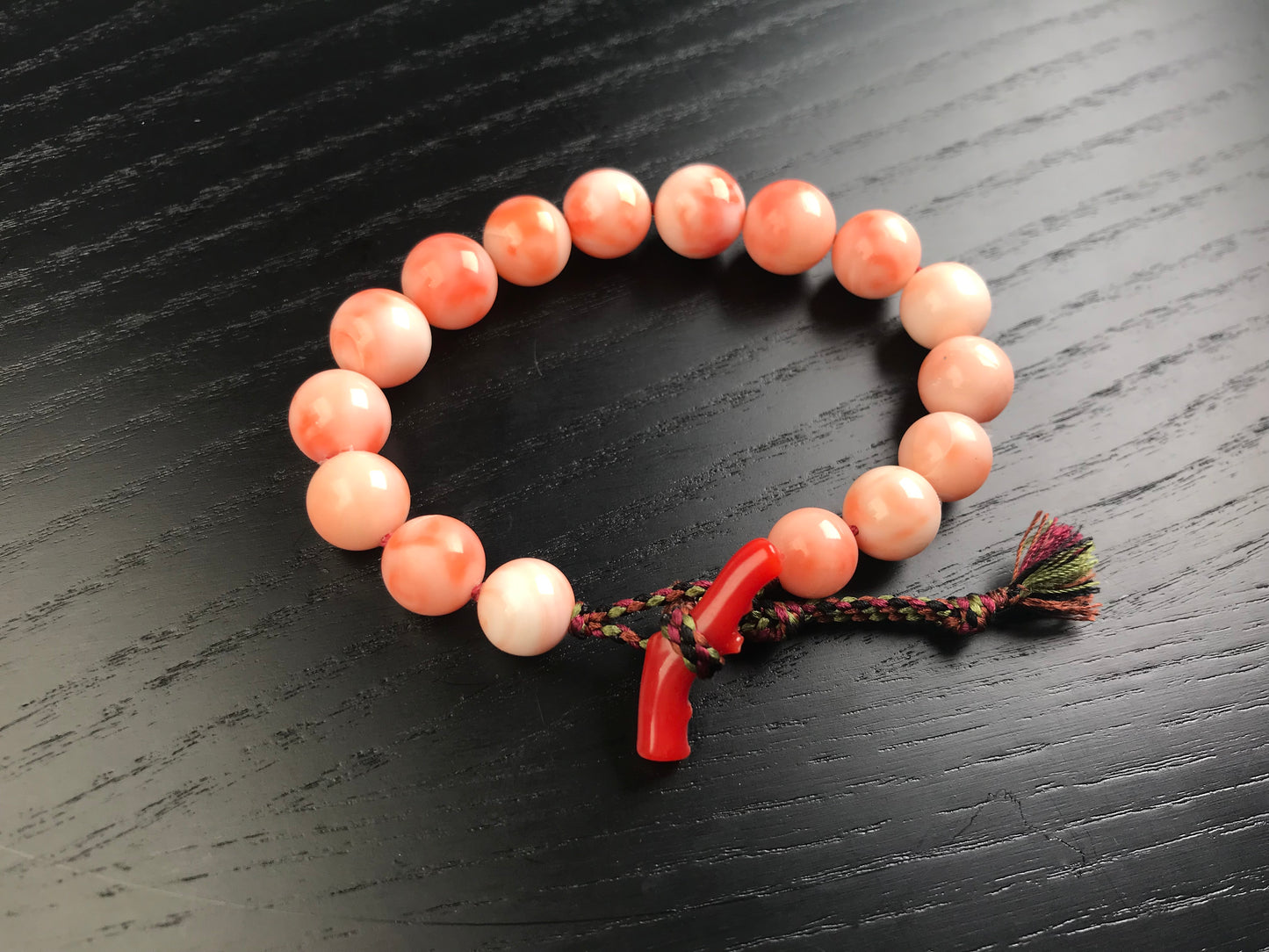 Large coral beads and silk Kumihimo bracelet