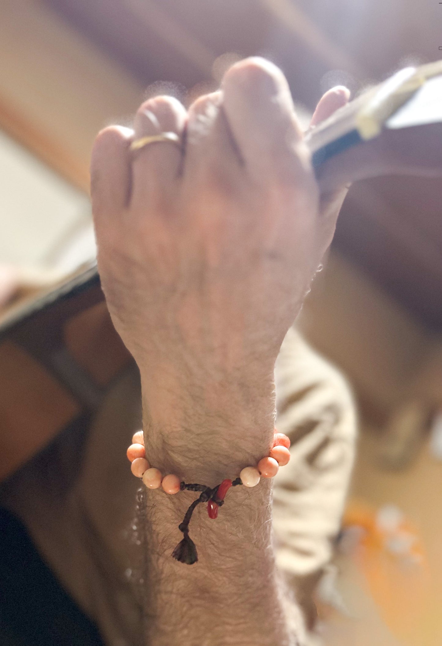 Large coral beads and silk Kumihimo bracelet