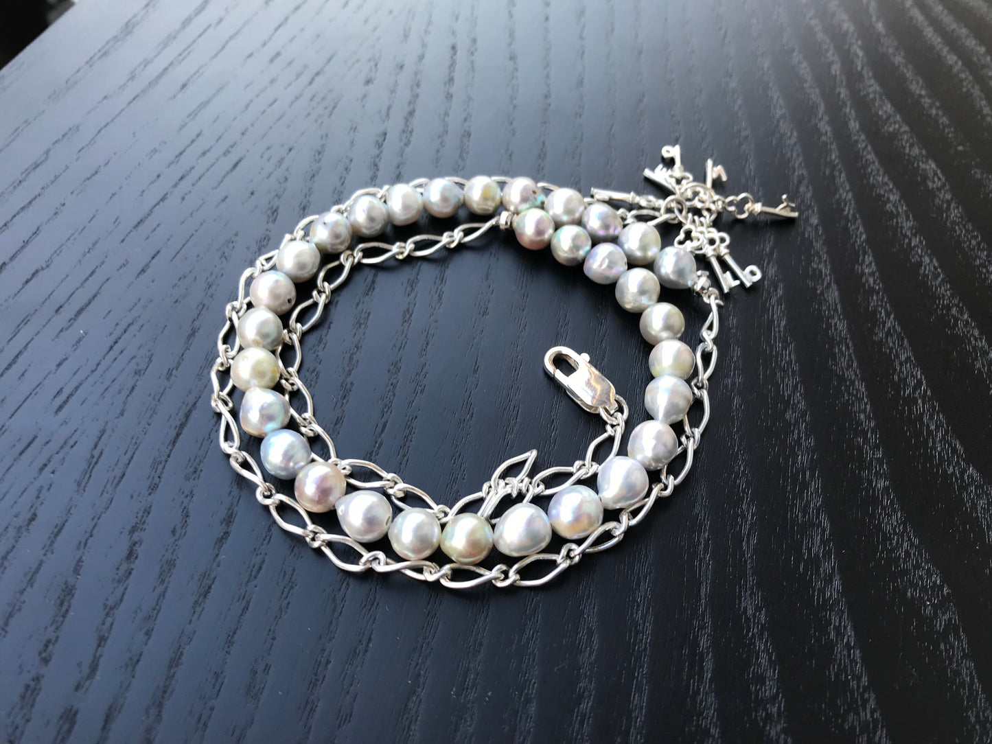 Silver blue Akoya pearl and silver charm necklace