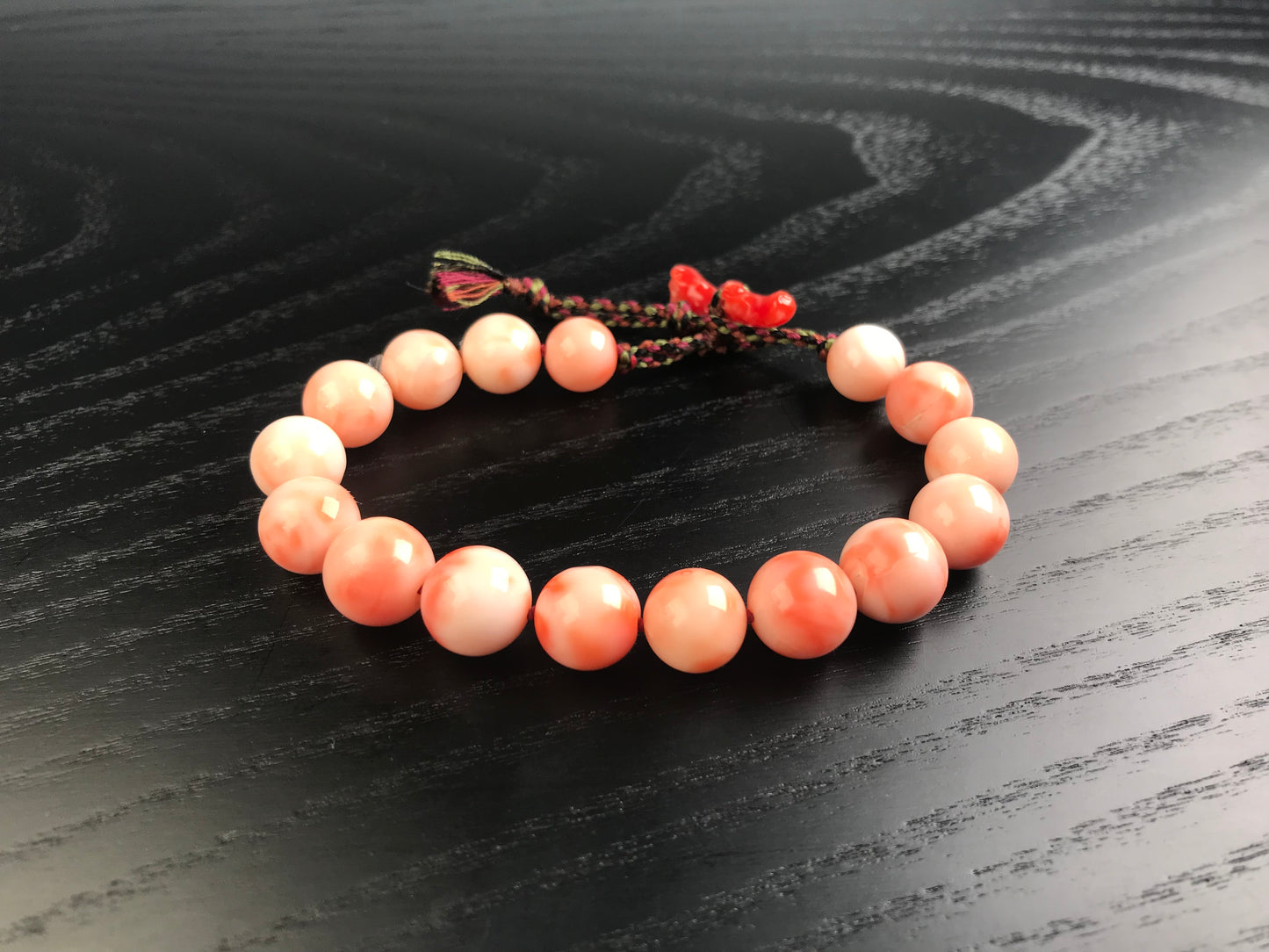 Large coral beads and silk Kumihimo bracelet
