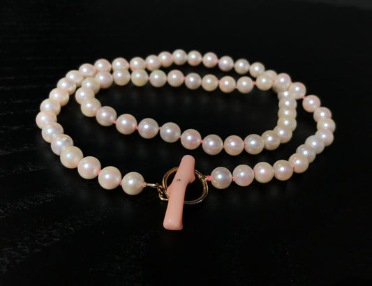 K18 Akoya pearl necklace with pink deep sea coral bar