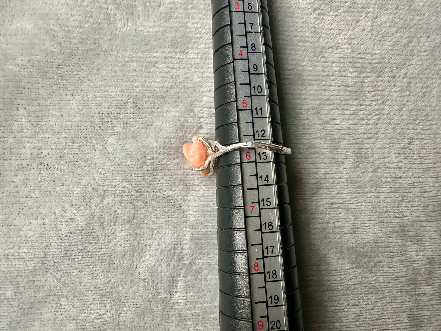 Carved angel skin coral rose ring with silver thorns