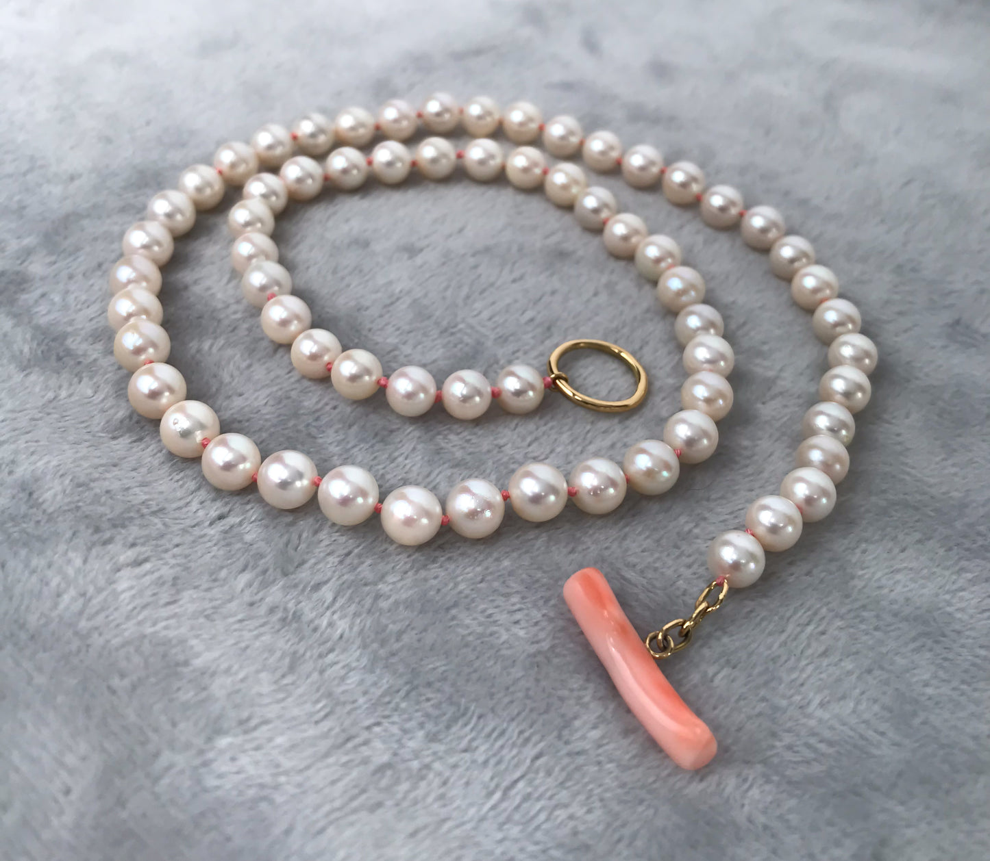 K18 Akoya pearl necklace with pink deep sea coral bar