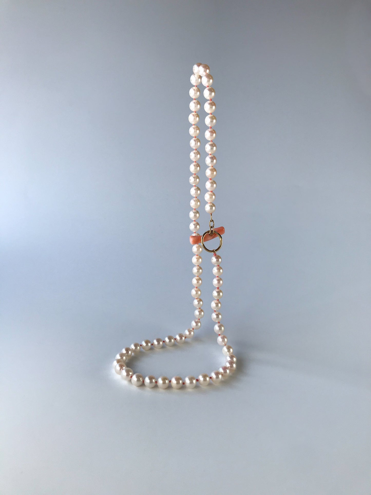 K18 Akoya pearl necklace with pink deep sea coral bar