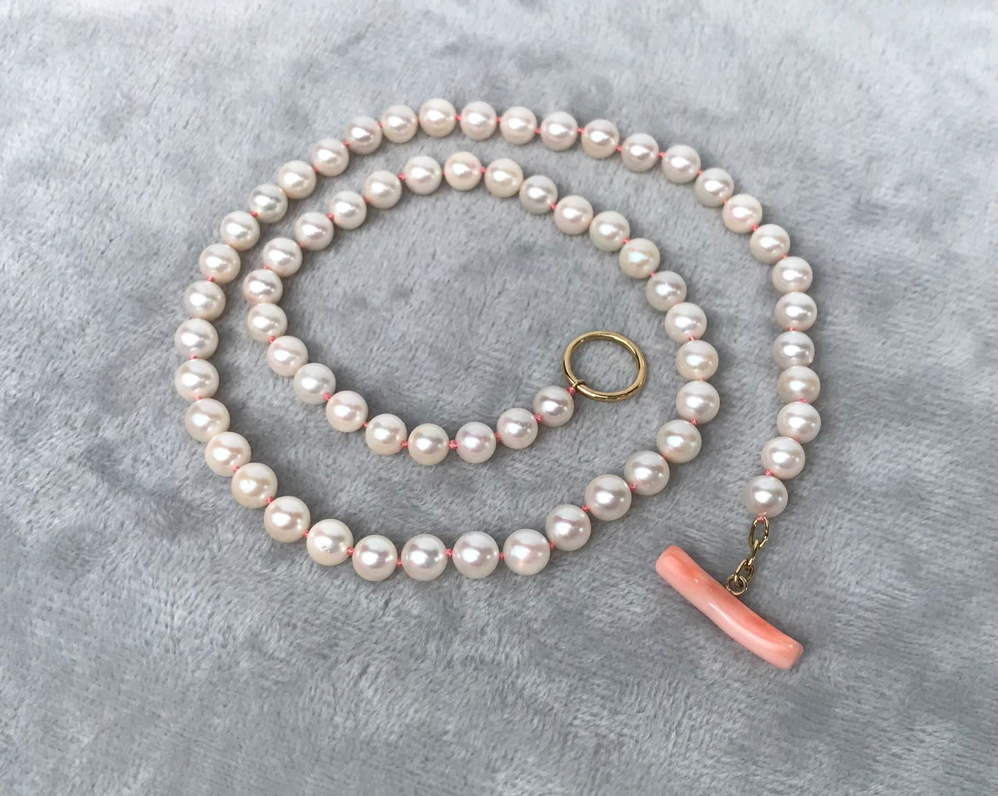 K18 Akoya pearl necklace with pink deep sea coral bar