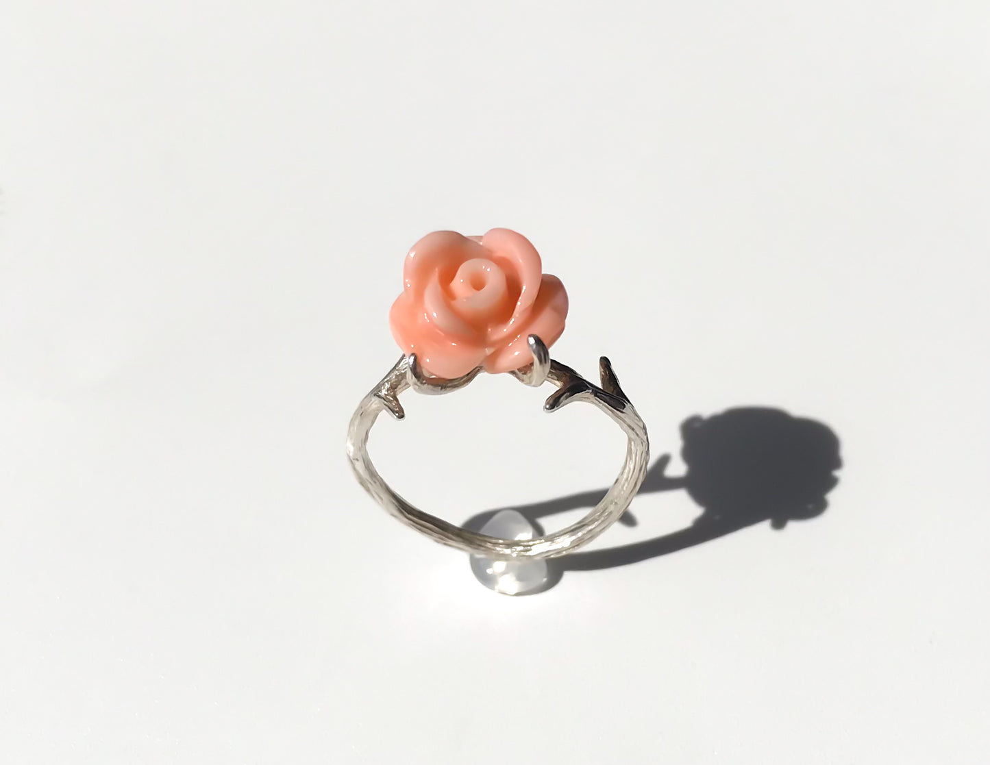 Carved angel skin coral rose ring with silver thorns