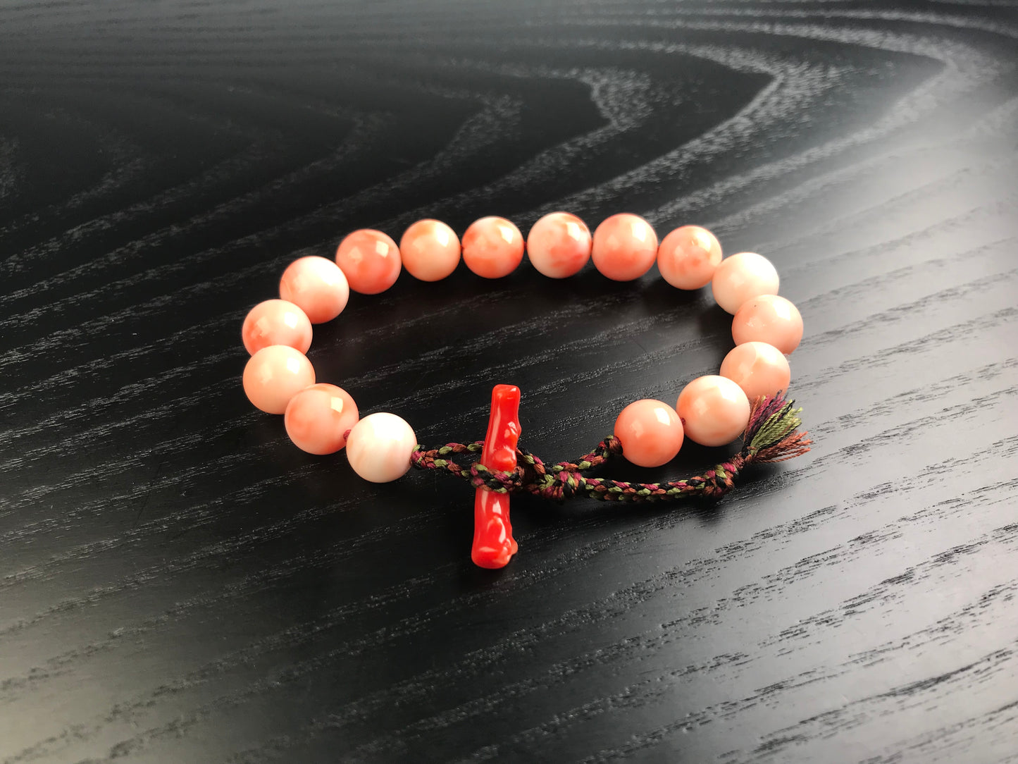 Large coral beads and silk Kumihimo bracelet