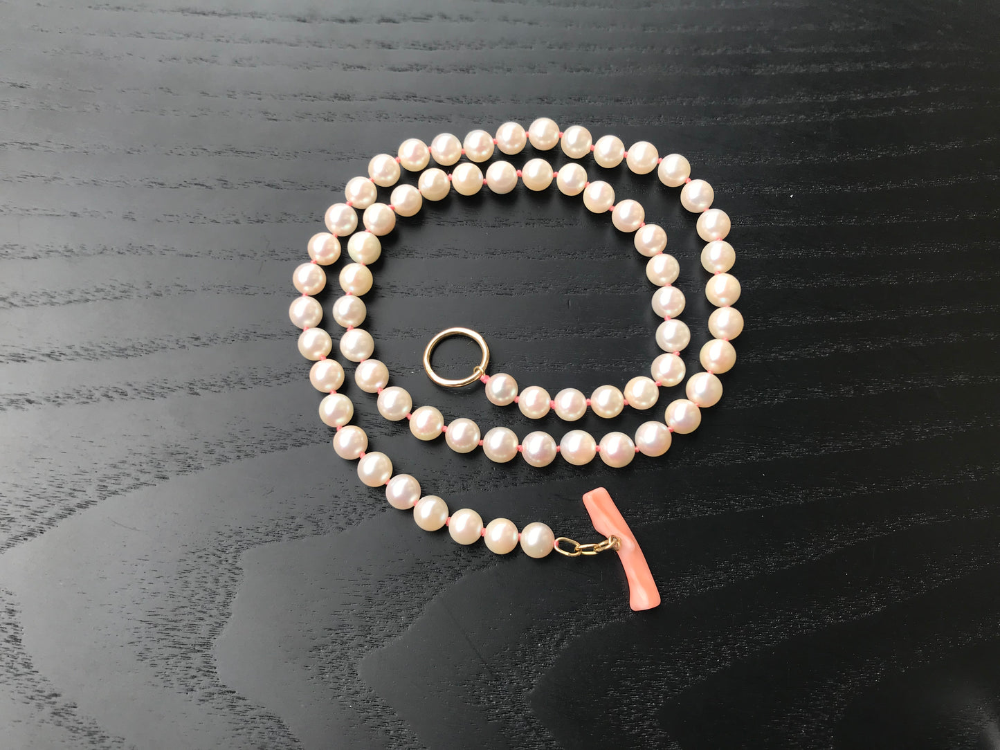 K18 Akoya pearl necklace with pink deep sea coral bar