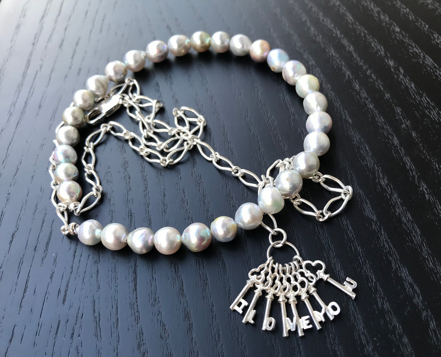 Silver blue Akoya pearl and silver charm necklace
