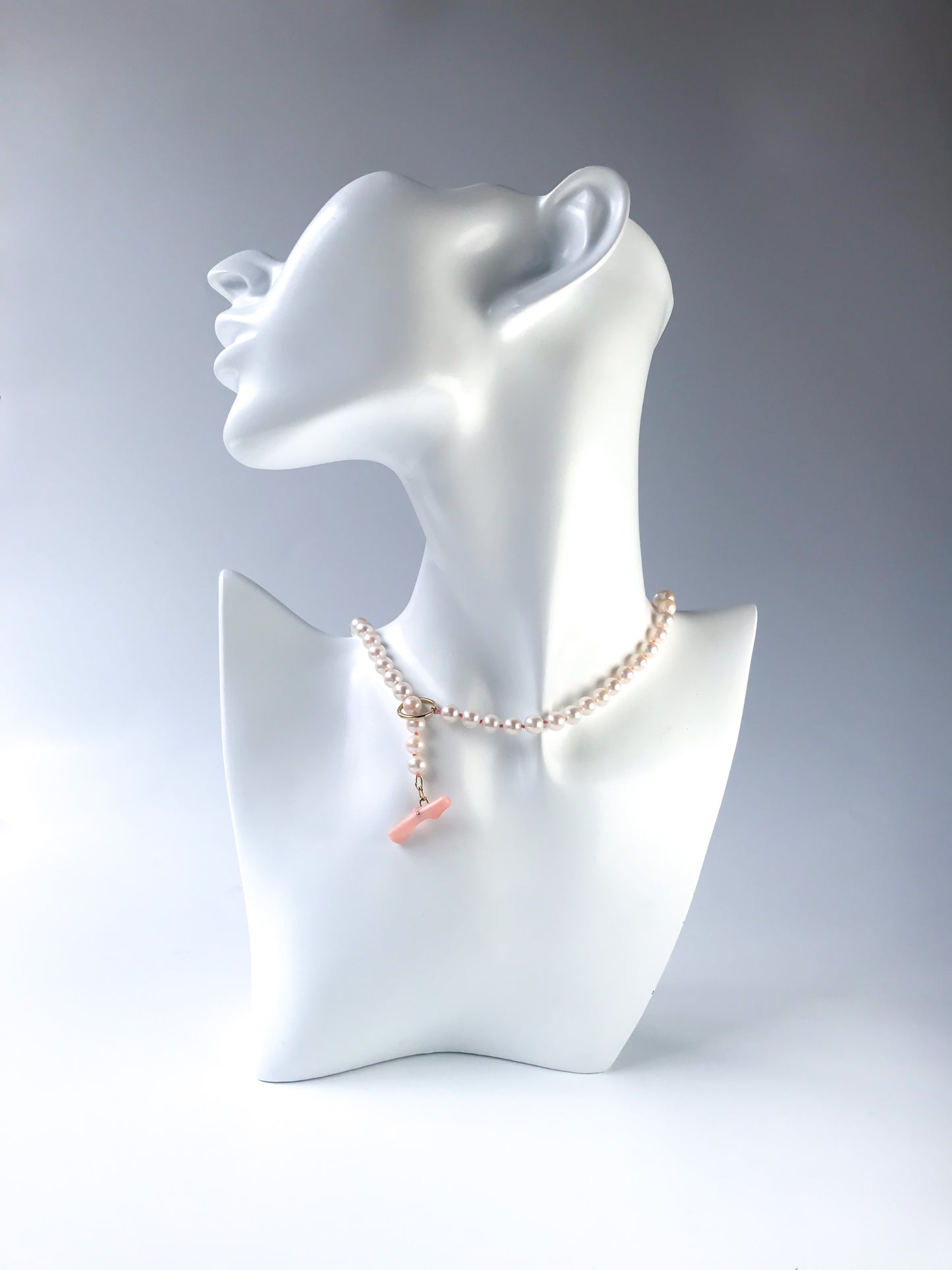 K18 Akoya pearl necklace with pink deep sea coral bar