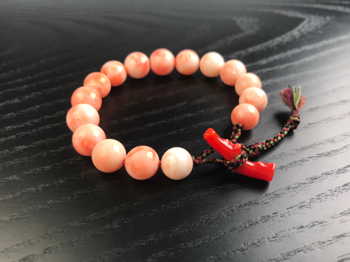 Large coral beads and silk Kumihimo bracelet
