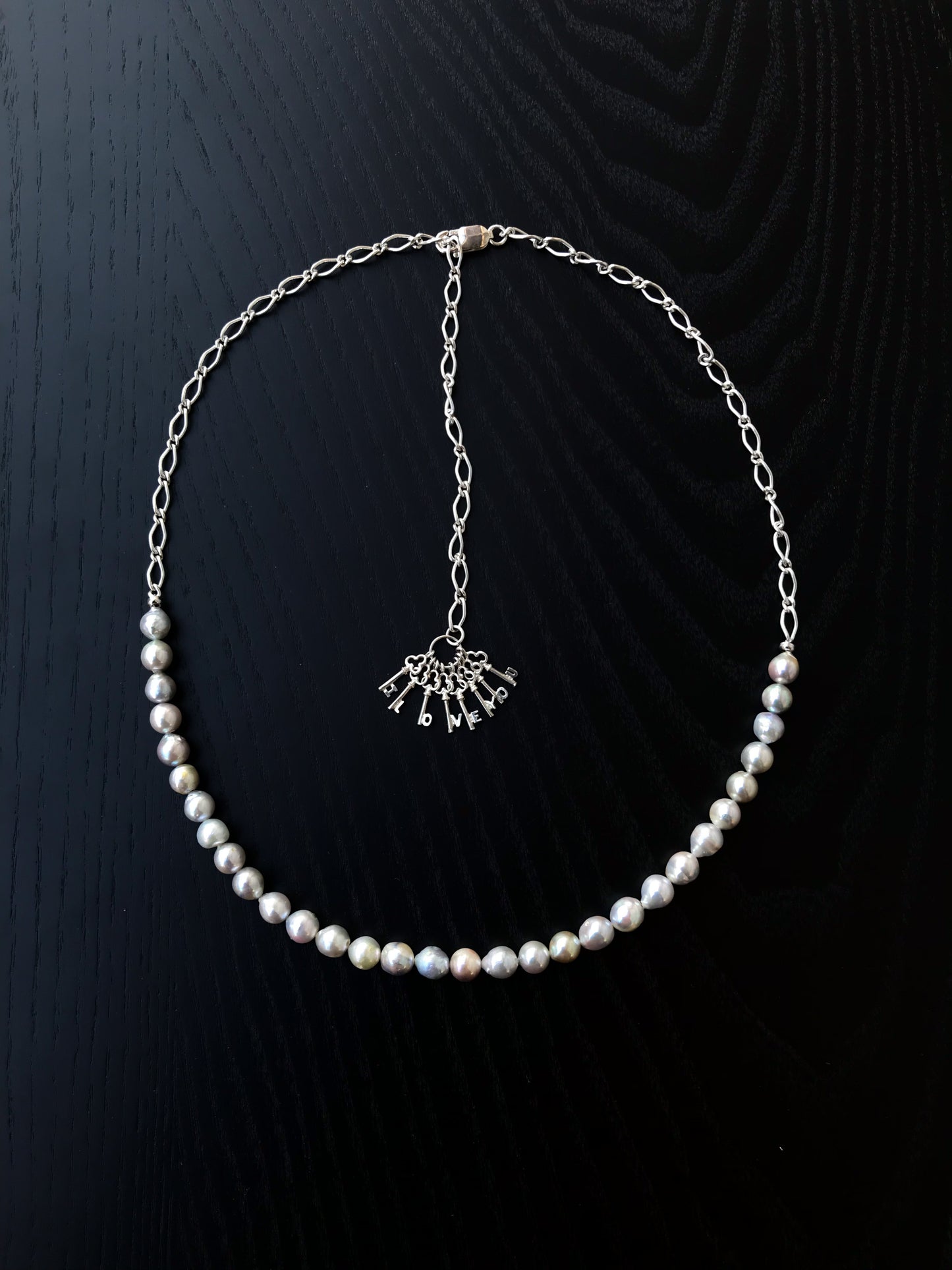 Silver blue Akoya pearl and silver charm necklace