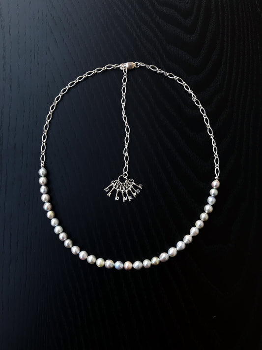 Silver blue Akoya pearl and silver charm necklace